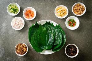 Miang kham - A royal leaf wrap appetizer photo