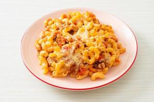 homemade macaroni bolognese with cheese photo