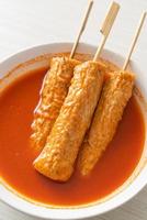 Omuk - Korean fish cake skewer in Korean spicy soup photo