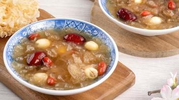 Close up of sweet snow white fungus soup with lotus seed, Chinese red dates and wolfberry. photo