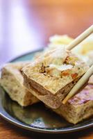 Deep fried stinky tofu with pickled cabbage, famous and delicious street food in Taiwan. photo