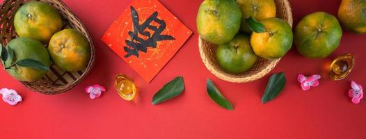 Top view of fresh tangerine mandarin orange on red background for Chinese lunar new year. photo