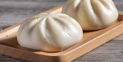 Close up of fresh delicious baozi, Chinese steamed meat bun. photo