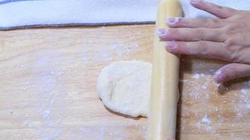 Lady is kneading bread dough - homemade bakery making concept video