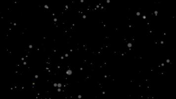 Weißes Schnee-Bokeh, das im dunklen Raum herunterfällt - Hintergrund der Computerbewegungsgrafik