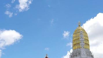 Time lapse of blue sky and moving cloud over white - golden pagoda in Wat Phra Si Rattana Mahathat, public famous temple of Phitsanulok Thailand video