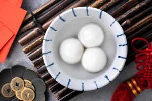 Top view of big tangyuan yuanxiao in a bowl on gray background for lunar new year food. photo