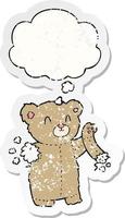 cartoon teddy bear with torn arm and thought bubble as a distressed worn sticker vector