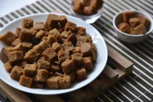 Spicy and spiced breadcrumbs on a white plate close-up. photo