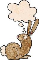 cartoon startled bunny rabbit and thought bubble in grunge texture pattern style vector