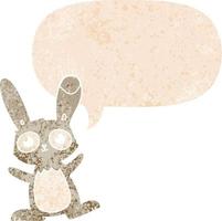 cute cartoon rabbit and speech bubble in retro textured style vector