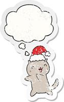 lindo gato navideño de dibujos animados y burbuja de pensamiento como una pegatina desgastada angustiada vector