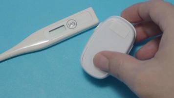 Oximeter usage. Finger pulse oximeter used to measure pulse rate and oxygen levels. video