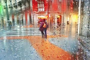 Bilbao, Vizcaya, Spain, 2022 - people with an umbrella on the street in rainy days, autumn season photo