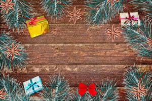 Winter background. Christmas composition with spruce branches and gifts. photo