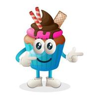 Cupcake mascot with smile expression and pointing finger, cupcake mascot illustration vector