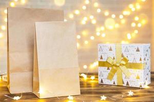 Christmas decor of food delivery service disposable kraft paper package. Ready-made order, eco-friendly recyclable packaging, zero waste. Holidays catering, making sweets home made. mock up, tag photo