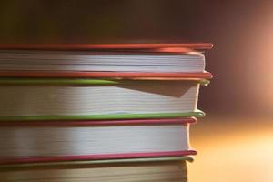 Close-up of a stack of books. The concept of home reading of paper books, school education and Institute, back to school. Space for text, background. photo
