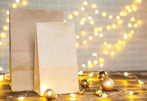 Christmas decor of food delivery service disposable kraft paper package. Ready-made order, eco-friendly recyclable packaging, zero waste. Holidays catering, making sweets home made. mock up, tag photo