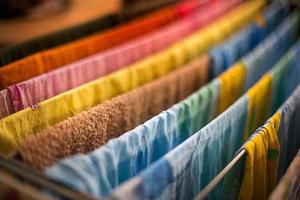 Colorful underwear is hung on the dryer after washing. General cleaning, Laundry drying, compact dryer for the house. photo