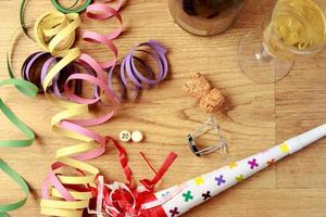 Party Decorations New Year's Eve with champagne on a parquet floor, with a white ball without a number, to put the year you want. Horizontal image. photo