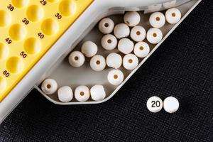 Year created with an electronic bingo balls, with a white ball without a number, to put the year you want. Horizontal image viewed from above. photo