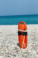 Red lifeguard float on the beach. Vertical image. photo