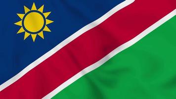 bandera ondeante realista de la república de namibia. video de 4k de bucle suave y sin interrupciones