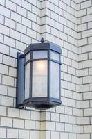 close up of street lantern on white brick wall, Street lightning decoration photo