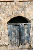 A door is an opening in a wall to enter and exit a building. photo