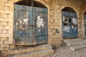 A door is an opening in a wall to enter and exit a building. photo