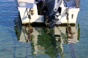 Motor and propeller of a motorboat. photo