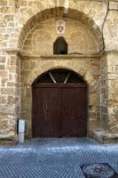 A door is an opening in a wall to enter and exit a building. photo