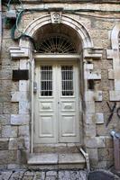 A door is an opening in a wall to enter and exit a building. photo