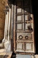 A door is an opening in a wall to enter and exit a building. photo
