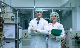 Portrait of scientists are in the chamber extracting oil and cannabis seeds. photo