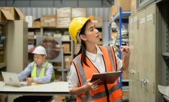 Warehouse Manager, Thinking and reviewing the preparation of products that must be distributed to retailers during the price increase in the market. photo