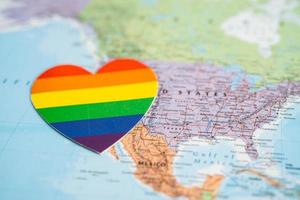 Bangkok, Thailand, 2022 - Rainbow color heart on globe world map background, symbol of LGBT pride month  celebrate annual in June social, symbol of gay, lesbian, bisexual photo