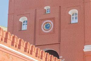 clock of the Troitskaya Tower Trinity Tower and fragment of kremlin wall photo