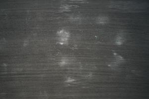 black wooden background with white stains photo