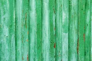 Old green painted wooden fence background photo