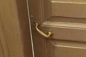 old wooden door with door knob closeup photo