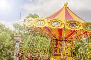 Colourful carousel in the Park. toned photo