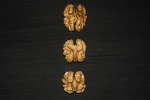 walnuts on black background. Top view with copy space for your text photo