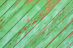 Old green painted wooden fence background photo