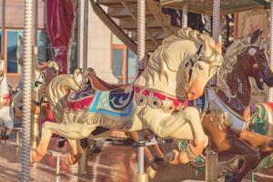 Horses on a carnival Merry-Go-Round. toned photo