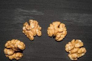 walnuts on black background. Top view with copy space for your text photo