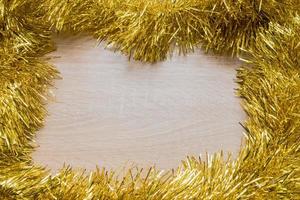 Christmas New Year holiday background. Golden tinsel. Copy space photo