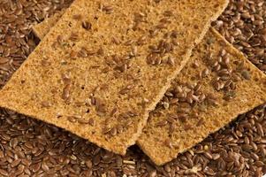 flax seeds and two slices of rye bread background photo