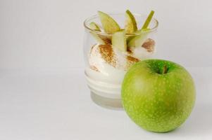 Fresh apple dessert with cinnamon and cream photo